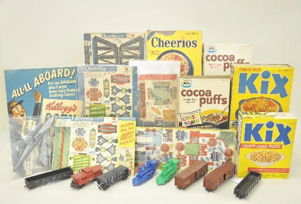 Nice Group of Early General Mills Cereal Premiums: 7 oz Kix Cereal dated 1949 with Kiddy Liner cut out promotion printed on box; Cheerios, the Great Locomotive Chase promotion with all three styles of train unpunched. Box is a photocopy. Cocoa Puffs c
