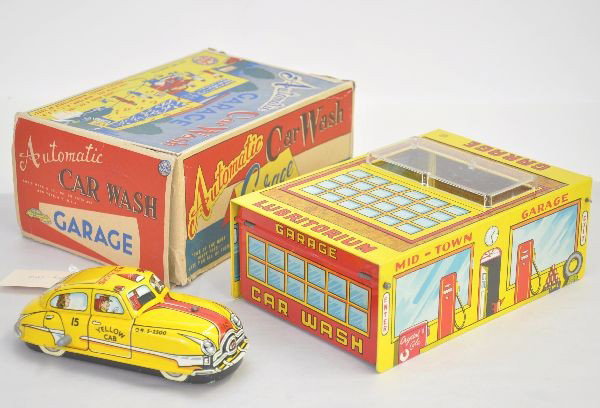 Like New Boxed Marx Automatic Car Wash: Set includes 7" yellow taxi, mechanism functional, mystery action and litho tin car wash. Appears unused with super original box showing only minor wear and insert.