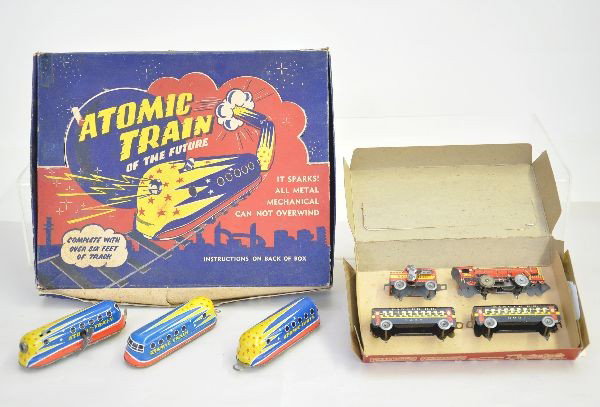 Two Boxed Tin Train Toys: Ranger #395 passenger set, unused, set tied into its original insert, like new C9; German Atomic Train of the Future made in West Germany, possibly Technofix. Litho loco, mechanism functional with two