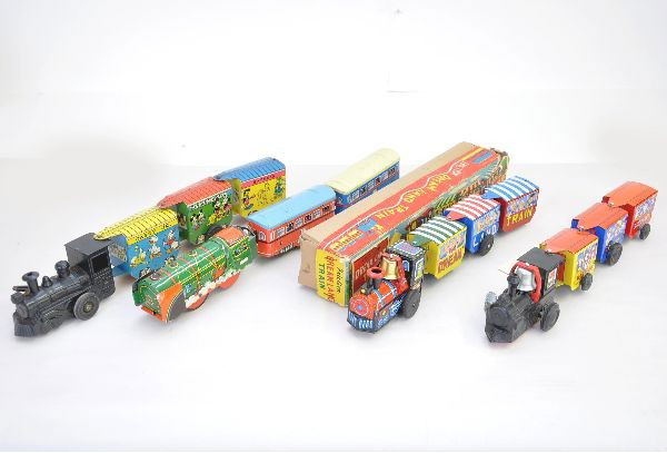 Four Zig-Zag Trains: Marx Disneyland Express, Marx Comic Express, TT Japan Dreamland train with original box and European 3 pc passenger set friction. Otherwise, clockwork mechanisms are functional All show light playwear