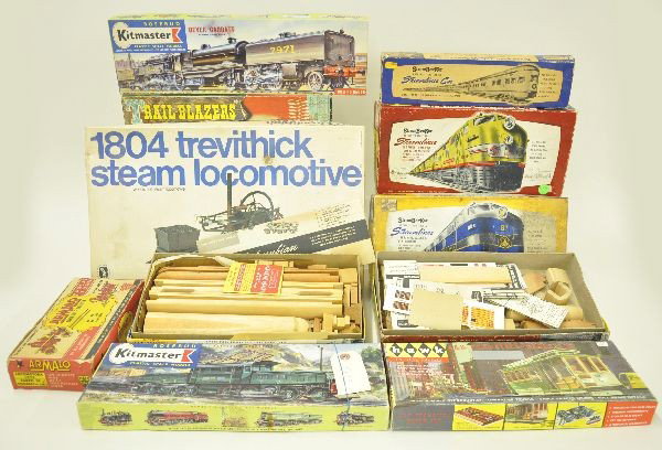 11 Boxed Train Model Kits: Kitmaster Crocodile locomotive, HO size, Kitmaster Bayer Garratt steam locomotive, HO size; ; Strombecker freight train, UP passenger train and B&O passenger train kits with separate sale B unit; Arma