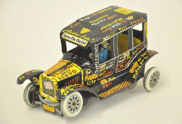 Rare PlastiMarx Old Jalopy: Litho tin, 7" long, missing a gear, clean and shiny, scarce variation with all Spanish lettering. Roof has a dent. Otherwise, shows light playwear. C8