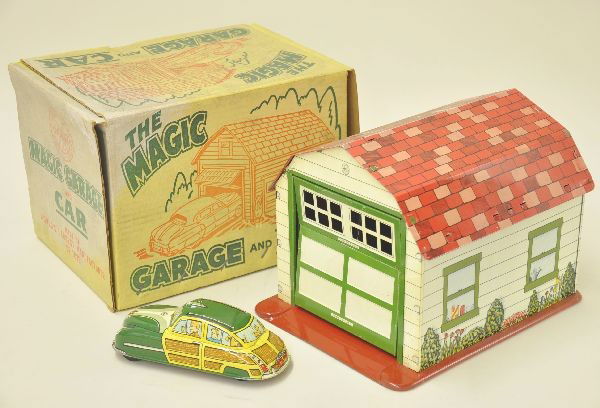 Boxed Marx Magic Garage and Car: Litho tin garage 11" long with opening door. Includes 7" woody wagon, mechanism functional Shows very light playwear overall. Original box. C8