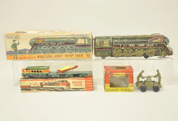 Three Boxed Military Toys: Bonnie Bilt railway handcar, original box worn; Modern Toy Japan battery operated Army troop train 16" long, German friction train with rocket launcher. Otherwise, original boxes. All show very light 