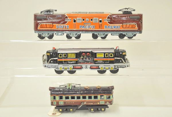 Three Nice Tin Toy Trains: Early 8 1/2" Interurban marked "Sightseeing Line" mechanism functional, with key and bell, marked Germany, shows moderate playwear, C6; 11" Cragstan diesel with operating pistons and a rare Maurisan S