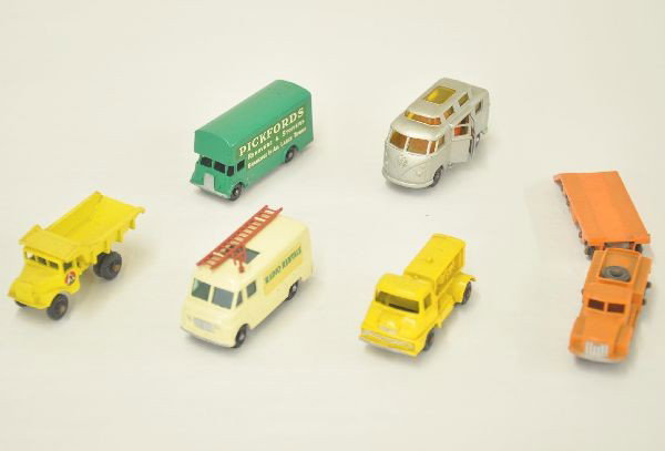 7 Matchbox Vehicles: #15 Rotinoff tractor; #16 Atlantic trailer; #62 radio rentals service van, complete but antennae is bent; #46 Pickfords van; #28 compressor truck; #6 dump truck; #34 VW bus. All have black plastic whe
