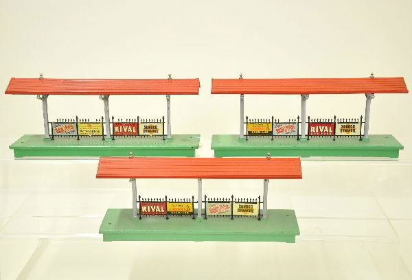 Three Lionel 156 Station Platforms: All post-war versions with original signs, missing one or two fence finials. Show light to moderate wear, should clean to C7 or better.