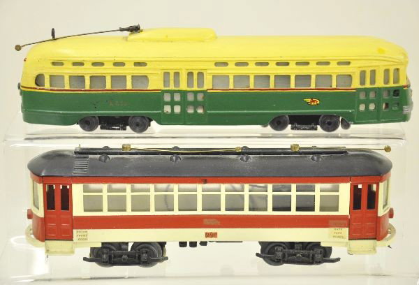 Two David O King Street Cars: 12" electric bus, this piece doesn't show up often. 10" Union Traction street car. Both O-Gauge, three rail, diecast body. Shows light to moderate playwear. C7