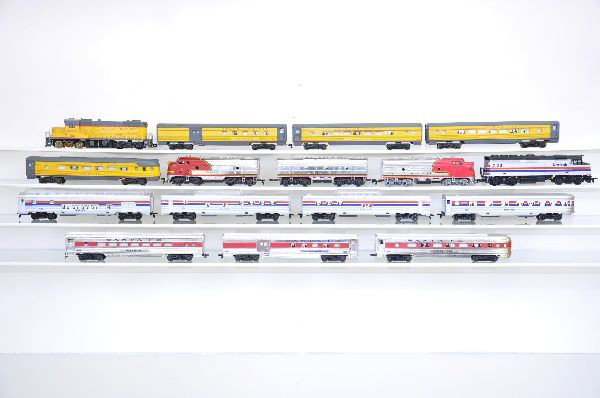 Three HO Gauge Passenger Sets: Mantua Santa Fe AB diesel with Bachman A powered with 3 Santa Fe passenger cars; 5 piece Life-Like Amtrak; Mantua UP diesel, brake tanks glued on with 4 passenger cars. Missing a few couplers, but cle