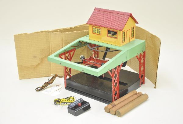 American Flyer 751 Log Loader: Tougher variation with black base. Complete, includes two original box inserts only. Shows moderate playwear. C6-7