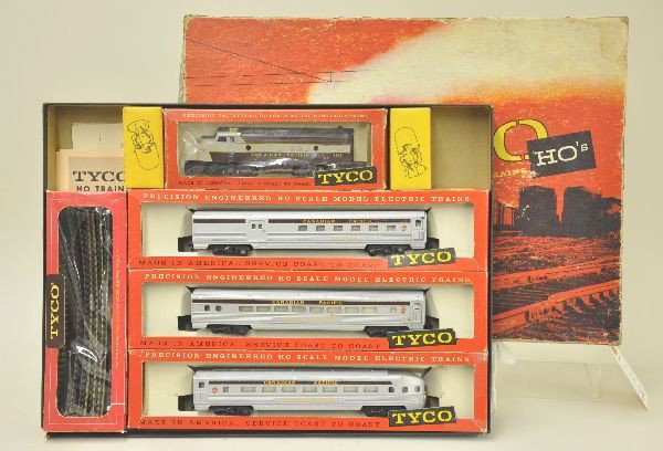 Boxed Tyco HO Gauge Set T5908 Canadian Limited: Circa 1960, F9 diesel, combine, coach, observation with track. Original boxes with inserts and instructions. Car boxes missing cellophane. Shows light to moderate playwear. Original set box worn. C7