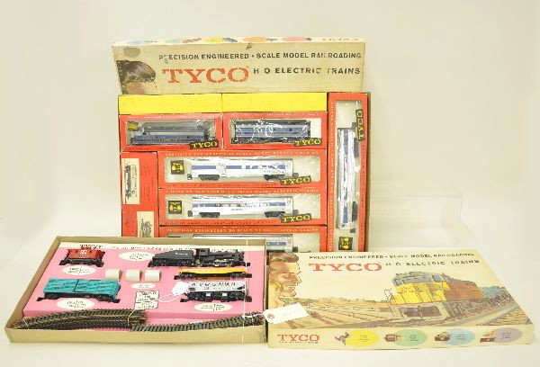 Two Early Boxed Tyco HO Gauge Train Sets: T6505-1998 The Shifter Limited. Steam loco and tender with 4 freight cars and track, set appears unrun, original box C8-9; T6414-4498 The Royal Blue passenger set includes F9 AB diesels with 4 passeng