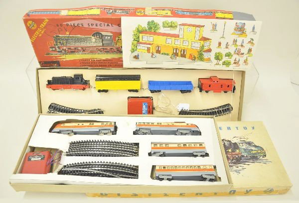 Two Boxed Distler HO Gauge Train Sets: Diesel Freight set, 242 diesel, 3 freight cars, cardboard accessories and instructions, battery, transformer and track; set 11977 TEE Streamline set, litho tin, diesel, two coaches, trail car, tract a