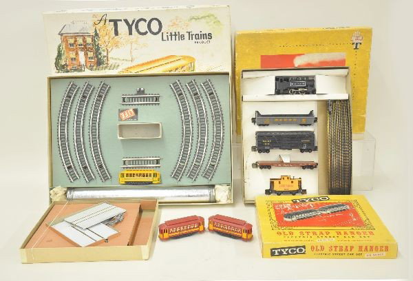 Three Boxed Early Tyco HO Gauge Sets: The Old Strap Hanger Set includes trolley and trailer and road track; Street Car Set includes trailer and track and battery pack; Set T5905 The Continental Steam Special , UP 0-4-0 switcher and 4 frei