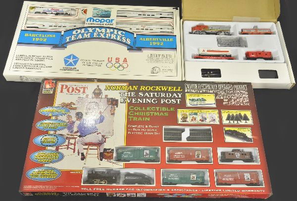Three Boxed HO Gauge Train Sets: Model Power 1096 CITGO promotional set which includes a Santa Fe F9 and 3 freight cars with track; Brookfield Mopar Olympic Team Express, F7 diesel and 3 passenger cars with original shipping box; Lif