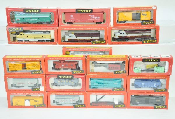 19 Early Boxed Tyco HO Gauge Pieces: Three F9 diesels, one B unit, and 14 freight cars. All 1950's. All original boxes, some are worn. Shows light playwear to like new. C7-8