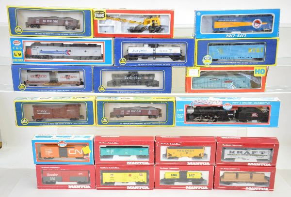 28 Boxed HO Gauge Pieces: Model Power Smoking Pacific, Model Power Amtrak E9 and 26 assorted freight cars by Mantua, Life-Like, and AHM. Also includes a city service hooker tank car promotion. All appear factory new, all origi