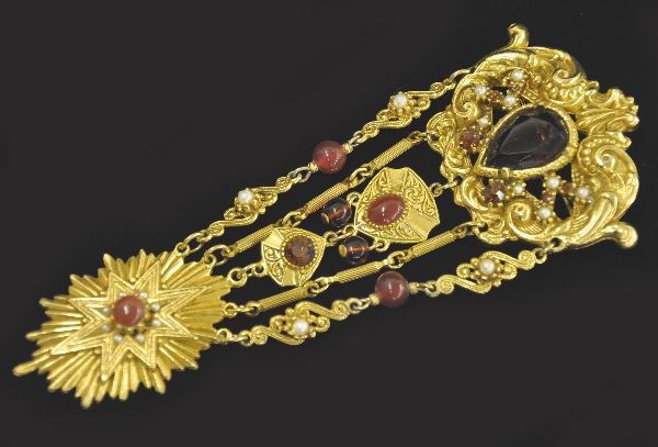 Unusual Fancy Coro Broach: Elegant 5 1/2" hanging broach, garnet colored center stone with garnet rhinestone, faux pearls and beads. Beautifully designed, signed Coro.
