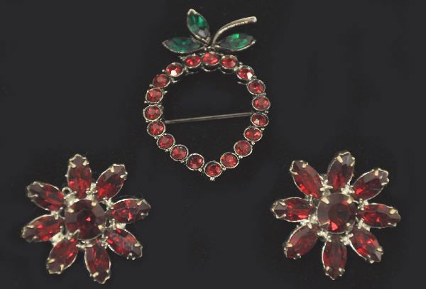 Unusual Weiss Strawberry Pin and Earrings: Nicely designed ruby colored stone strawberry open broach with emerald colored glass leafs and matching ruby colored stone earrings. All signed Weiss.
