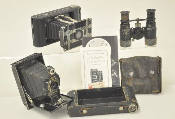 3 pc Camera and Field Glass Lot: Jiffy Kodak twin lens camera with partial box and instructions, Kodak #2 folding camera with worn leather case. Pair of Viascope 6X spotter field glasses with distance scale. Some wear and corrosion b