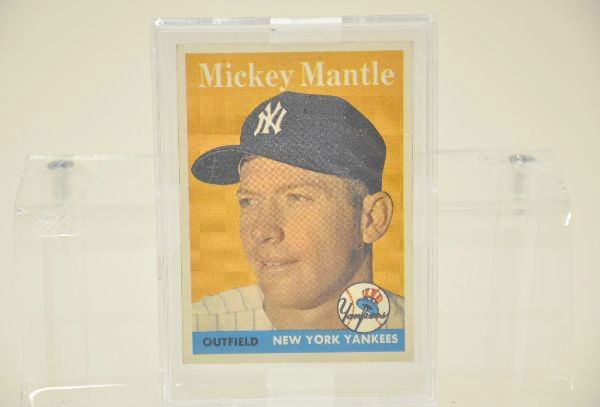 1958 Topps Mickey Mantle Card: Card No.150 in crisp, clean condition with only slightly fuzz on the corners. Beautiful near mint example.