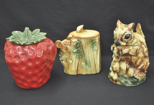 Three McCoy Figural Cookie Jars: Tallest is 12", McCoy Chipmunk, McCoy Koala Bear in Tree, bottom crazed and small flake in ear. McCoy strawberry jar, minor paint wear under top, top has small chip on leaf tip.