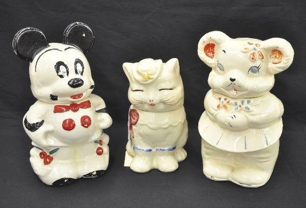 Three Animal Cookie Jars: Tallest is 13", Puss N Boots, turn-about mouse , shows some paint wear. Turn about Mickey and Minnie Mouse, shows some paint wear.
