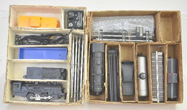Boxed Marx Sets 4316 and 25220: 4316 includes 490 loco with sound, tender, gondola, caboose, track and transformer. Set 25220 includes 999 scale loco, NYC tender, Niacet tank car, NYNH&H boxcar, NYC pipe flat (missing hold down), NY