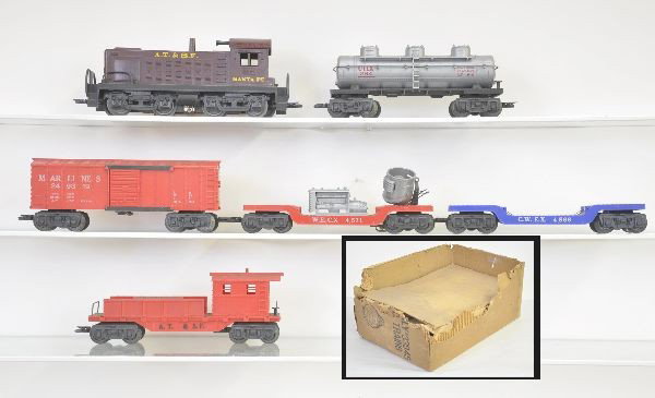 Partially Boxed Marx Set 33945: Montgomery Ward Set includes 1998 Santa Fe diesel, 4566 flat with reels (missing hold-down), Marline operating boxcar with platform, 4571 search light car, (missing lens), UTLX tank car, Santa Fe work