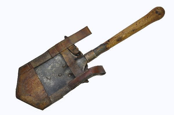 WWI German Trench Shovel and Accessory Belt: Shovel dated 1915 with original leather belt holder. 21" long, embossed Bleckmann Murzzuschlag. Also includes a three compartment accessory pouch in leather with brass clasps, possibly for ammunition.