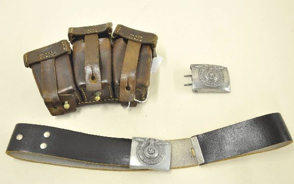 WWII Nazi Uniform Accessory Lot: Leather belt with nickel buckle and extra duplicate buckle worded Meine Thre Heisst Treue and a three section Mausser ammunition pouch with brass and copper fittings.