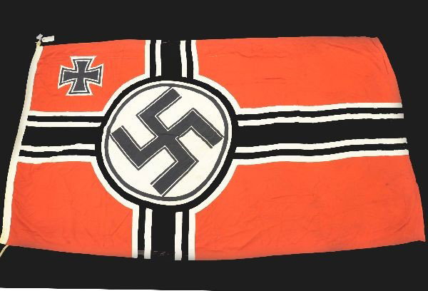 Scarce Nazi Flag: 48 x 90" National Socialist Battle Flag. Shows a few small holes, has original rope sewn in. Some light staining. Color is bright and even. Lettered on top edge Witte K.G. Munchen.