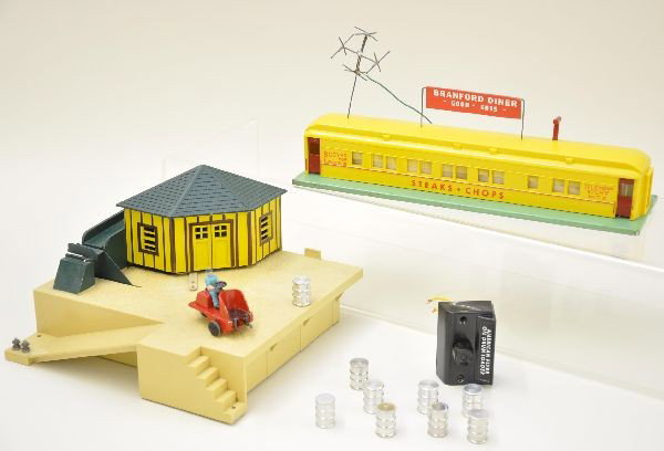 American Flyer 779 and 767 Accessories: 767 Branford Diner complete, minor repair to antenna: 779 oil drum loader with controller, replacement drums. Both are clean and show light to moderate playwear. C7
