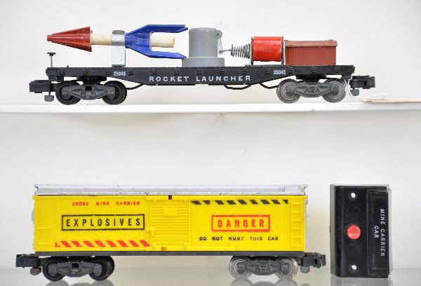 American Flyer S-Gauge 25062 and 25045 Action Cars: 25062 exploding mine carrier with controller and 25045 rocket launcher. Both show light to moderate playwear, should clean to C7 or better.