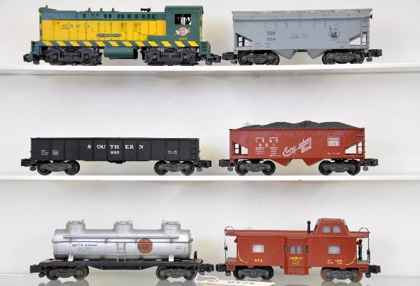 American Flyer S-Gauge Diesel Freight Set: 355 C&NW Baldwin diesel, hairline screw crack; 924 cement car, one chipped step; 927 gondola; 926 Gulf tank car; 921 CB&Q hopper; 979 bay window action caboose, minor rust spots on ladders. Otherwise,