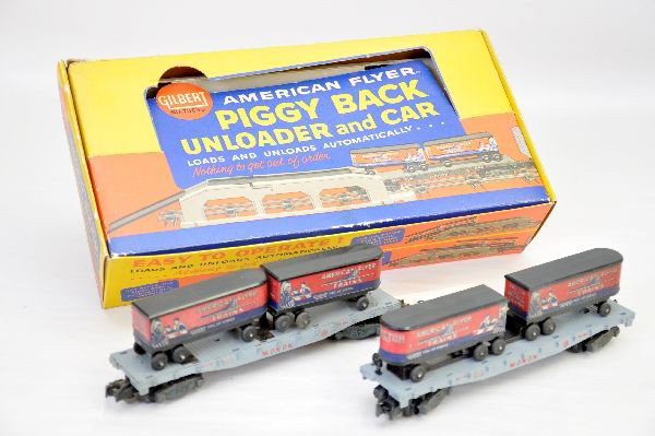 Boxed American Flyer 23830 Piggy Back Set Plus: S-Gauge. Set includes 24550 Monon flat with tractors and unloading mechanism, instructions and packet. Original set box with insert, shows very light playwear. C8. Plus, 956 Monon flat with trailers, 