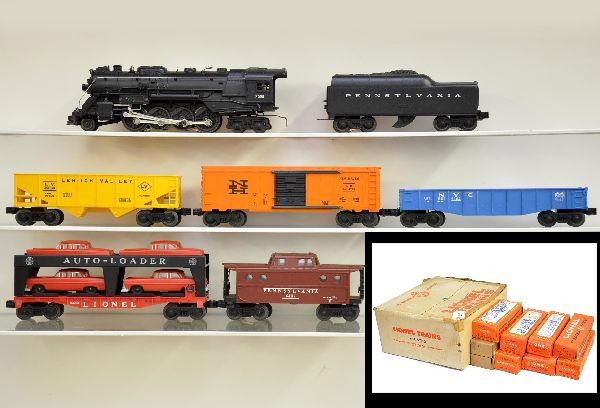 Boxed Lionel Set 12710: Circa 1966. 736 Berkshire loco; 736W Penn tender; 6176 LV hopper; 6162 gondola, missing canisters; 6414 auto loader with red cars, gray bumpers; 6464-725 New Haven boxcar, Type IV; 6437 Penn N5c caboo