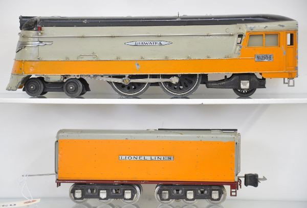 Lionel 250E Hiawatha Freight Locomotive: Top of the line for 1936, two wheels show some fatigue, one eccentric rod broken; 250W tender with manual box coupler. Fairly clean and shiny. Otherwise, shows moderate playwear. C6