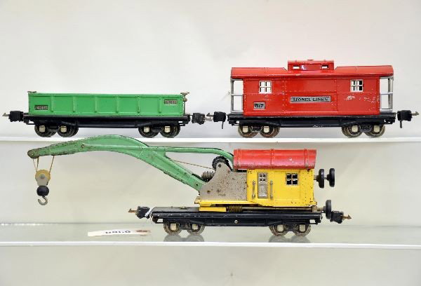 Lionel Freight Car Lot: 812 gondola; 810 wrecker, working; 817 caboose. All have manual box couplers. Shows moderate to heavy playwear. C5-6