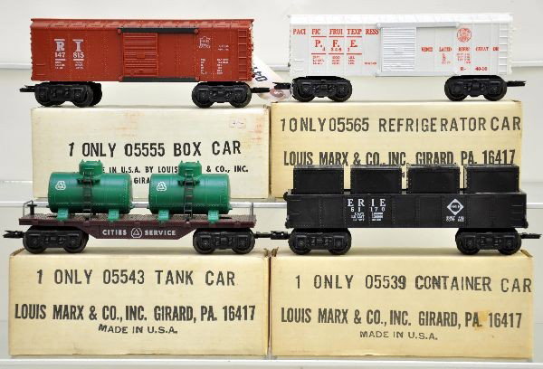 Boxed Marx Freight Cars: 05565 reefer, 05555 Rock Island boxcar, 05539 Erie container car with worn insert, 05543 CS tank flat. All have F trucks. Tank has been lightly run. Otherwise, unrun. Nice original boxes. C8-9