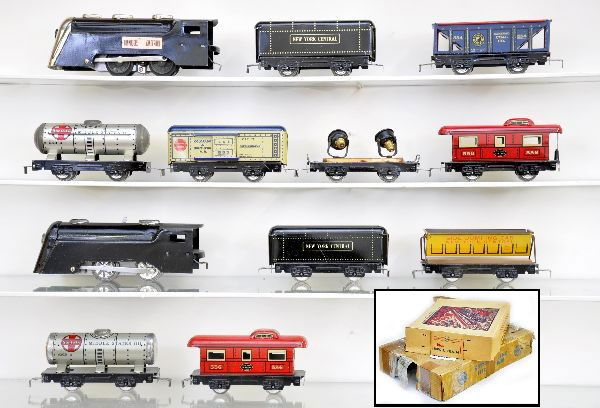 Boxed Marx Sets: Set #763, includes CV loco with NYC tender; NYC side dump car; Santa Fe tank car; NYC red caboose. Mechanism functional with key, original worn set box. Second set includes Commodore Vanderbilt loco,