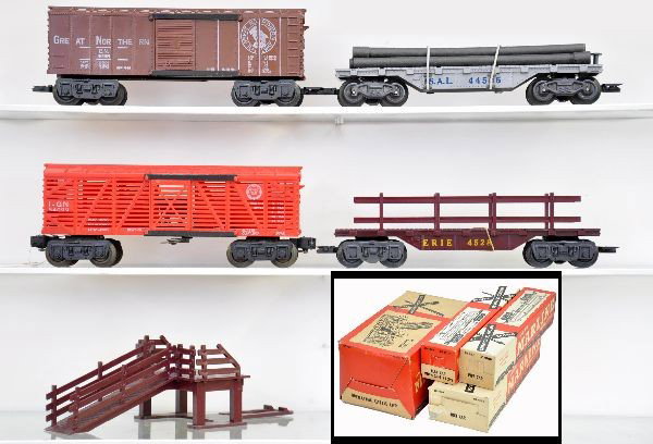 Boxed Marx Rolling Stock: 05528 flat with rails, 05555 GN boxcar, scarce 5535 SAL pipe car, 05570 operating cattle car with ramp. Nice original boxes, cars show light playwear to like new C8