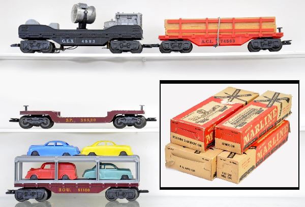 Boxed Marx Rolling Stock: 5583 rotating searchlight car, 5538 well type flat car, 5585 auto loader, scarce 5563 ACL lumber car. All have original boxes showing some wear, cars are like new. C8