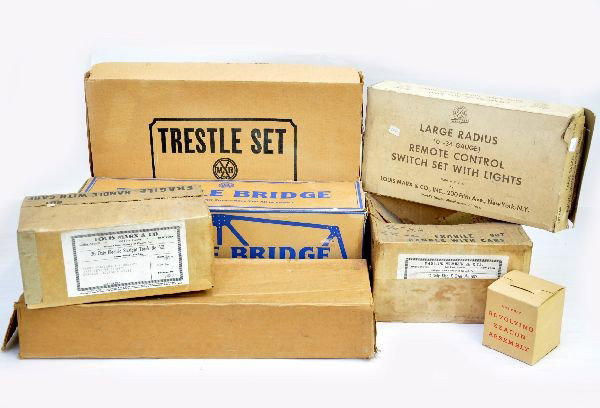 Boxed Marx Accessories: Wabash trestle bridge, beacon assembly, 1412 MO trestle set, 1392 lift bridge, 1810 large radius switches, 601 36 pc straight track, partial 607 box of crossovers with rough ob. Otherwise, nice origin