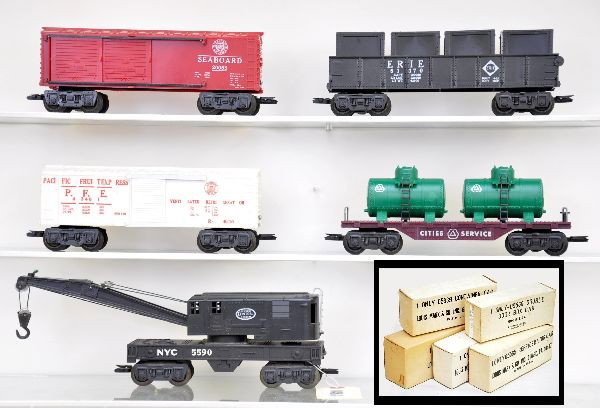 Boxed Marx Rolling Stock: 5540 crane with insert, 5543 City Services tank flat, 5539 gondola with containers and insert, 5565 reefer, 5560 Seaboard auto boxcar in red. Most unrun with crisp original boxes C8-9