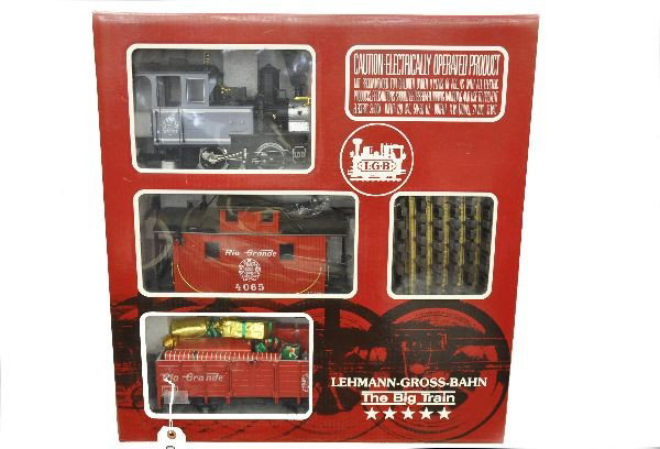 Boxed LGB Set 20087: G-Gauge, Set includes 100 Rio Grand Steam Loco, Rio Grande open car (with Christmas package load) Rio Grand caboose, 4 figures, track and transformer, shows light playwear. Original set box C8