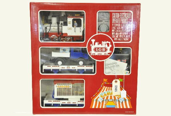 LGB G-Gauge Circus Set 21988: Includes #2 steam loco, flat with truck, flat with lion cage, ringmaster, monkey, track and transformer. Instructions, original set box with insert. Shows light to moderate playwear. C7