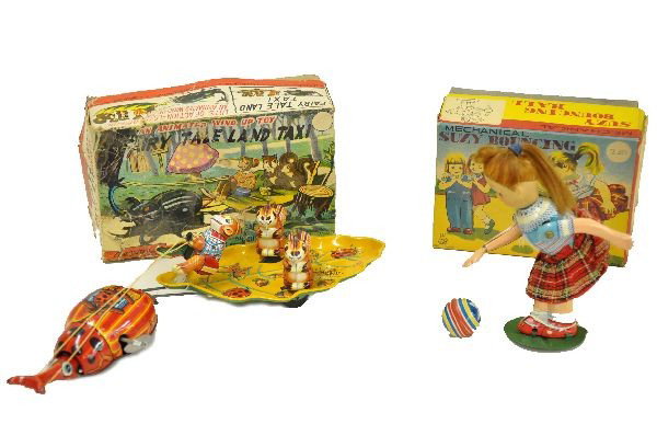 Boxed TPS Tin Toys: Fairy Tale Land Taxi; Snail pulling monkey and squirrels on leaf, 12" overall length; Suzy Bouncing Ball. Both mechanisms are functional, original boxes show some wear, toys are like new. C8-9