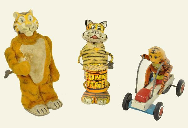 Marx Esso Tiger Toys: 8" plush walking tiger, fur shows soiling; funny tiger with drum, 7" tall, missing drum sticks; unusual 6" tiger cart, friction functional. Otherwise, shows moderate playwear, C6-7