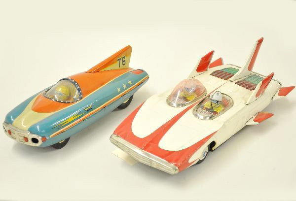 Vintage Tin Future Cars: Cragston dual driver future car, 11" long, battery operated, mechanism functional with siren, lighted engine and mystery action. Missing one plastic dome; 9" long TKK #76 rocket car, friction function